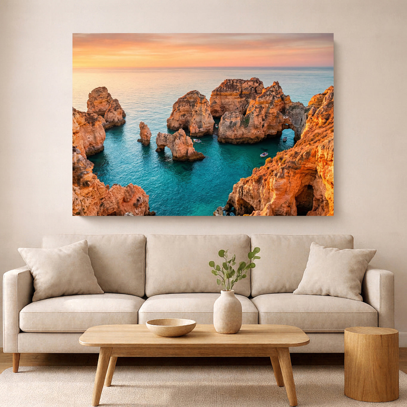 Living room with a large wall art of rocky coastline and ocean.