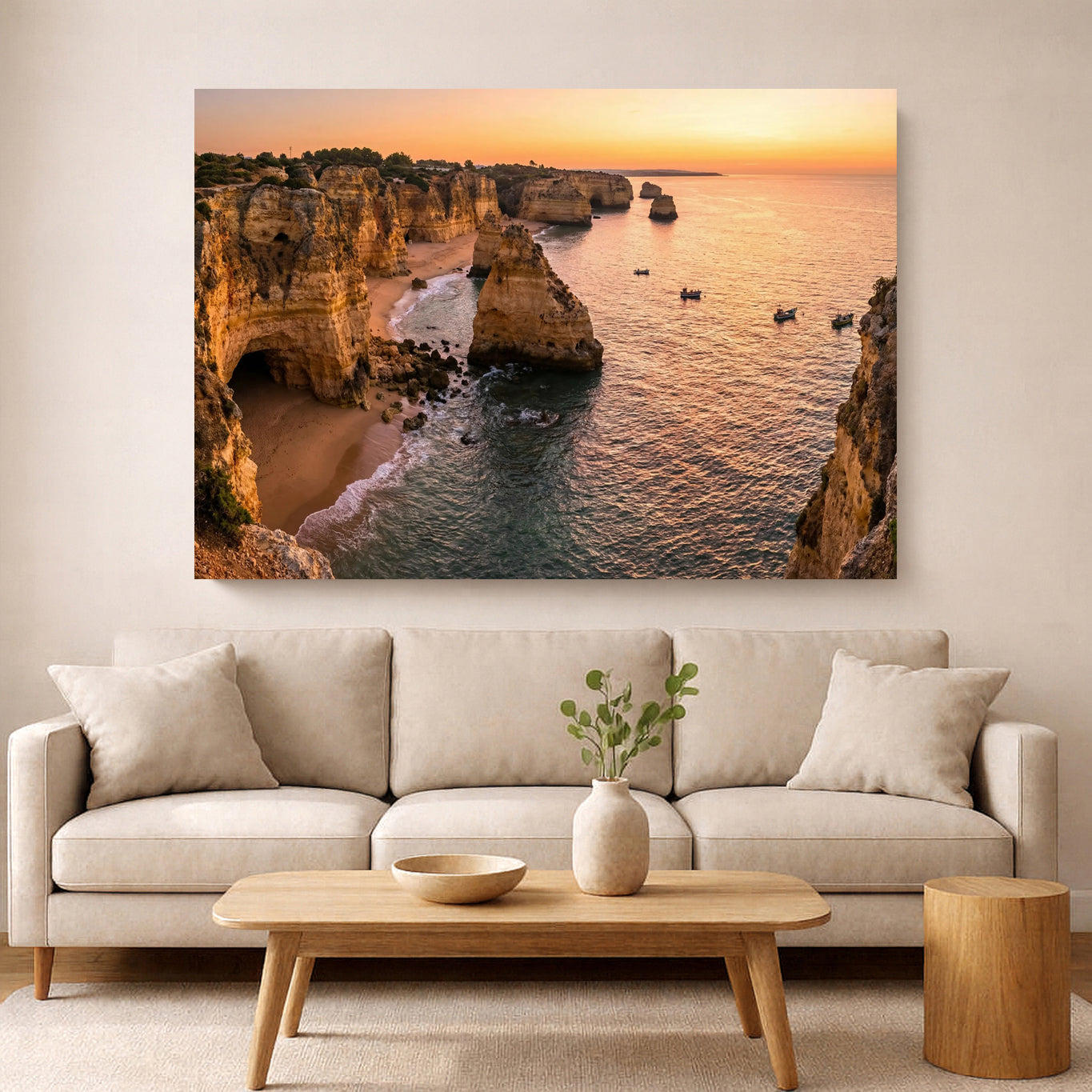 Living room with a large wall art depicting a coastal scene with cliffs and sunset.