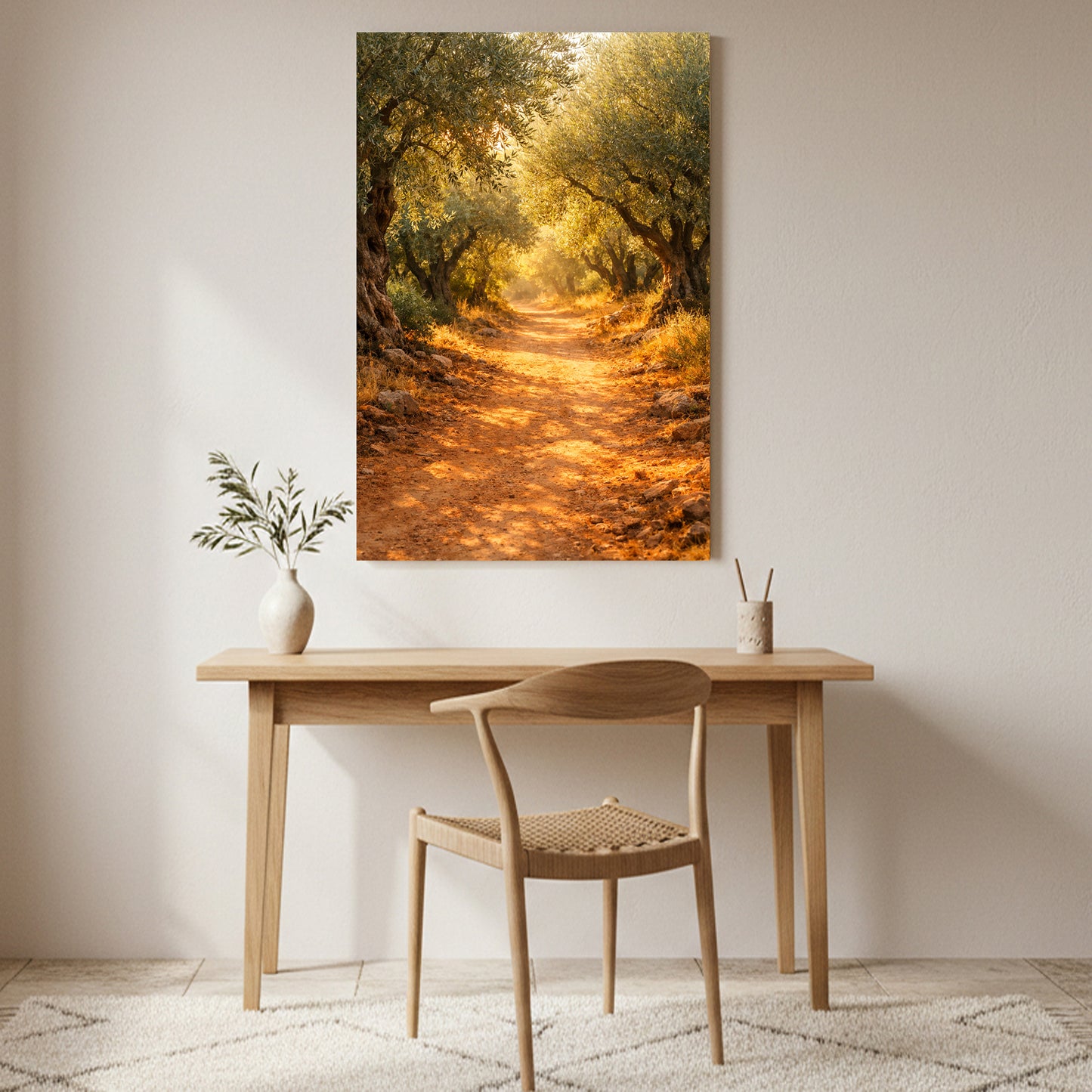 Sunlit olive grove path canvas wall art displayed above a wooden desk in a warm minimalist home interior - Portugal Canvas Co