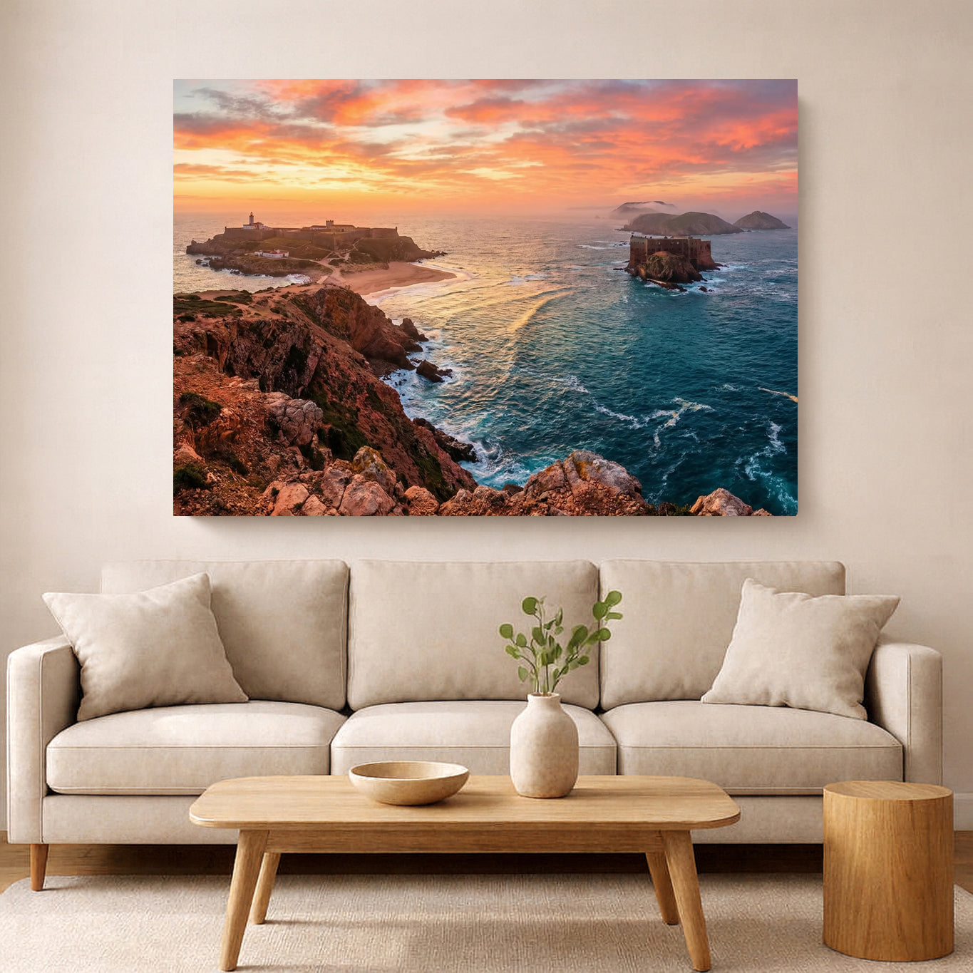Landscape painting of a sunset over a coastal scene above a beige sofa in a living room.