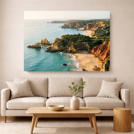 Beige sofa in a living room with a large wall art of a coastal landscape.