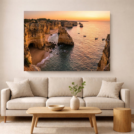 Living room with a large wall art depicting a coastal scene with cliffs and sunset.