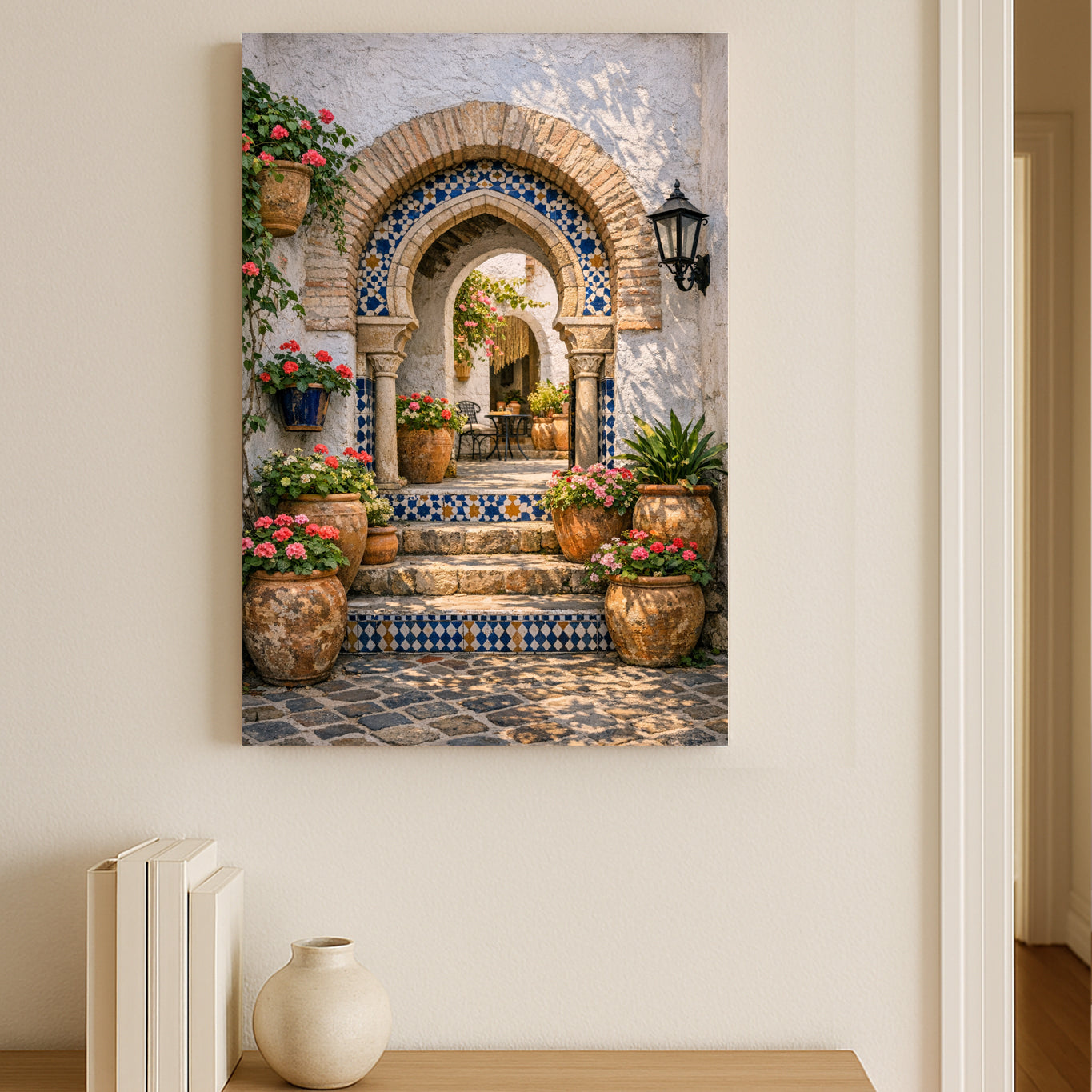 Decorative wall art of a Spanish-style archway with flowers and mosaics on a white wall.
