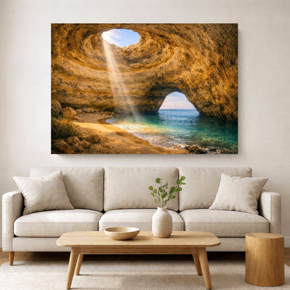 Benagil Cave interior canvas print – golden sandstone cave walls with sunbeam light through circular ceiling opening and turquoise sea visible through natural rock arch Algarve - Portugal Canvas Co 