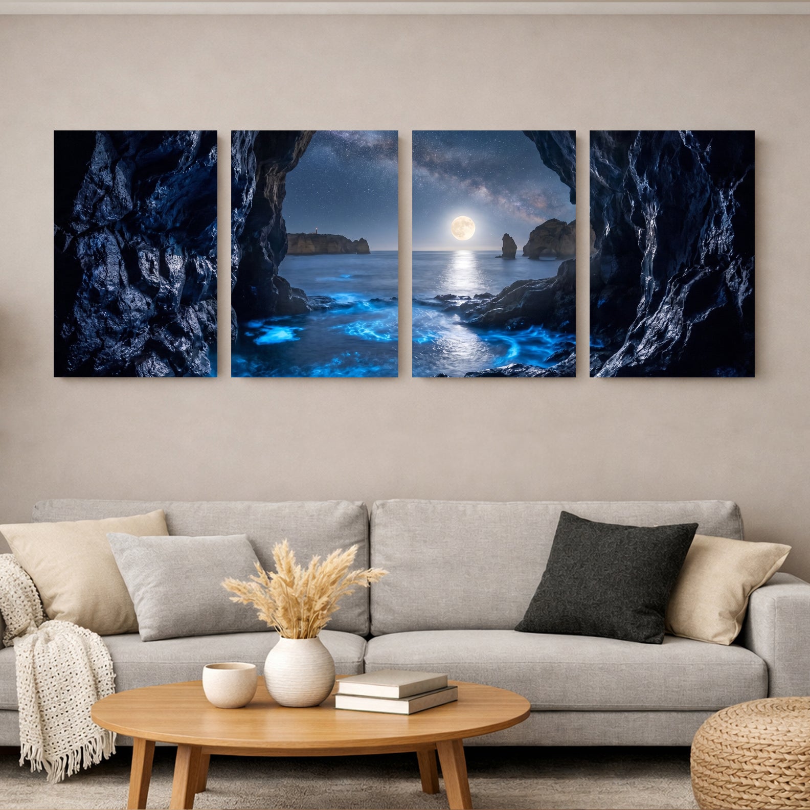 Moonlit sea cave four-panel canvas wall art displayed above grey sofa in warm minimalist living room, bioluminescent blue ocean waves and full moon night scene - Portugal Canvas Co