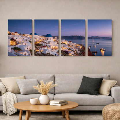 Santorini Oia village at night four-panel canvas wall art with whitewashed buildings, blue domed churches and purple twilight sky over the caldera - Portugal Canvas Co