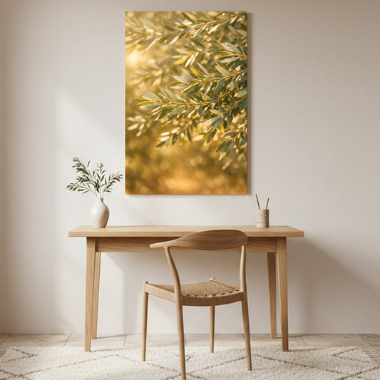 Golden olive branches canvas wall art displayed above a wooden desk in a warm minimalist home interior - Portugal Canvas Co