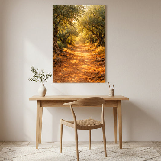 Sunlit olive grove path canvas wall art displayed above a wooden desk in a warm minimalist home interior - Portugal Canvas Co