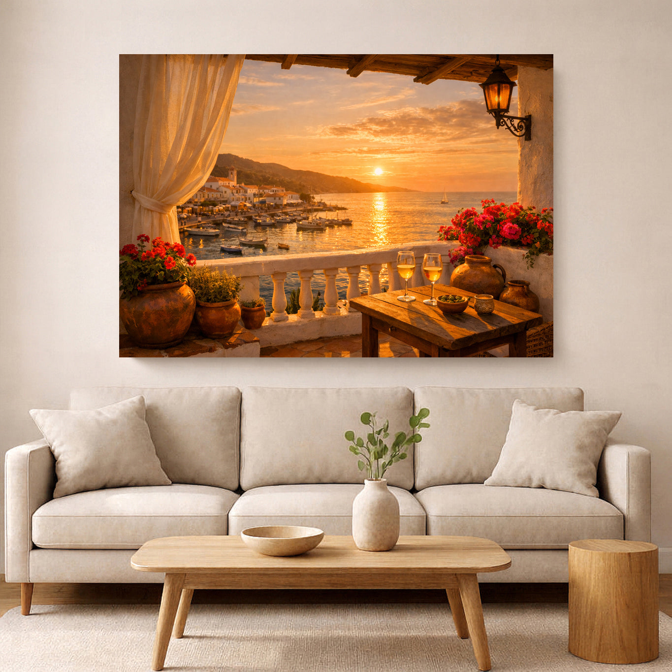 A large rectangular wall art print showing a warm sunset harbor scene with flowers, tables, and a balcony, displayed above a light beige sofa in a styled living room.