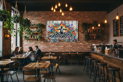 From the Ashes We Rise Banksy-style graffiti canvas wall art with hooded figure, flames and colourful flowers displayed on a brick wall in a vibrant urban coffee shop with Edison bulb lighting - Portugal Canvas Co
