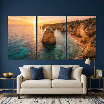 Algarve coastal sunset three-panel canvas above a cream sofa against a navy blue living room wall - Portugal Canvas Co