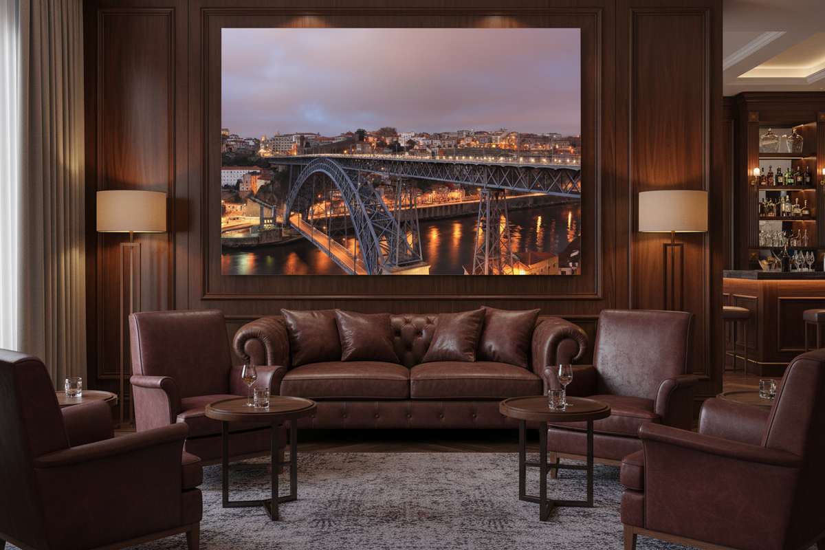 Porto Dom Luis I bridge night canvas wall art displayed in a sophisticated hotel bar lounge - Portugal Canvas Co