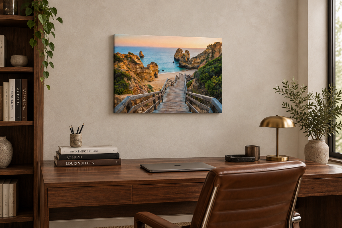 Algarve beach staircase canvas with cliffs and sea at sunset above a walnut desk in an upscale home office - Portugal Canvas Co
