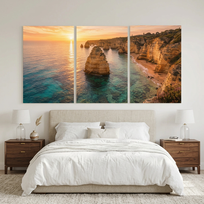 Algarve coastal sunset three-panel canvas above an upholstered bed in a neutral bedroom - Portugal Canvas Co