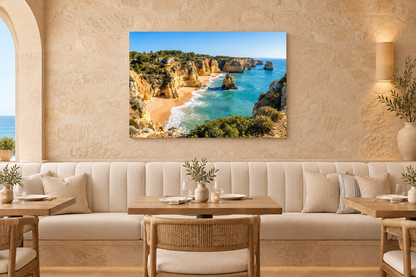 Algarve golden cliffs and turquoise sea canvas above ivory banquettes in a luxury coastal restaurant - Portugal Canvas Co