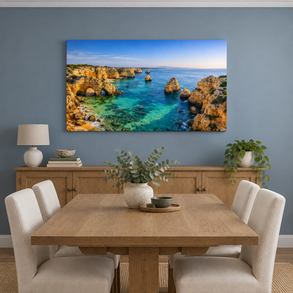 Golden coastal cliffs and turquoise sea landscape canvas wall art in a dusty blue dining room - Portugal Canvas Co