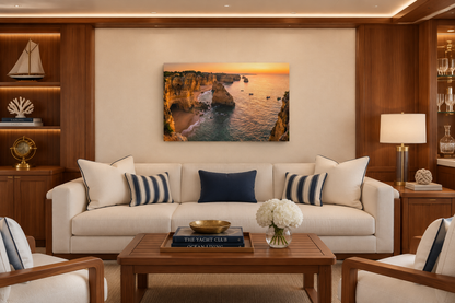 Algarve cliffs sunset canvas above ivory seating in a teak-lined yacht club lounge - Portugal Canvas Co