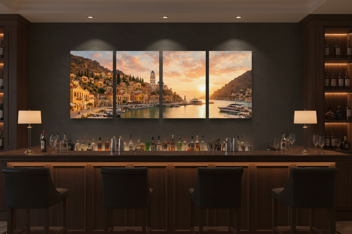 Symi Harbour Sunset four-panel canvas wall art displayed in a stylish bar interior with moody atmospheric lighting and leather stools - Portugal Canvas Co