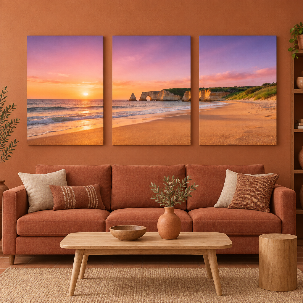 Three-panel Algarve cliff arch and beach sunset canvas set above a terracotta living room sofa - Portugal Canvas Co