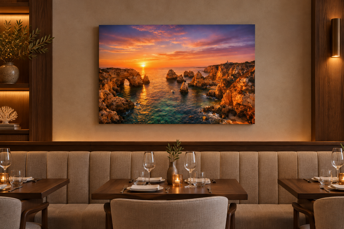 Ponta da Piedade sunset canvas above linen banquette in an elegant coastal restaurant - Portugal Canvas Co