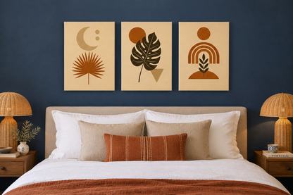 Terracotta boho botanical three-panel canvas wall art above a bed in a navy blue bedroom - Portugal Canvas Co