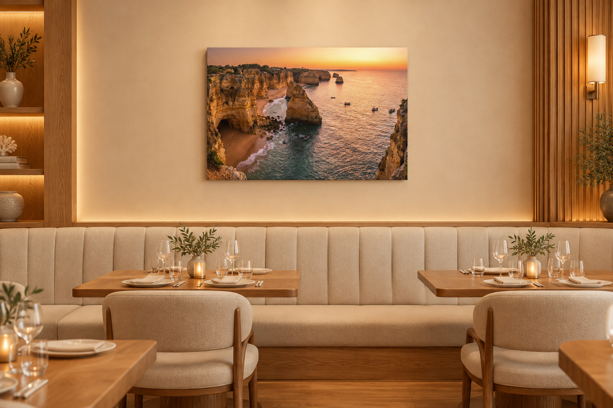 Algarve cliffs sunset canvas above cream banquettes in a fine dining coastal restaurant - Portugal Canvas Co