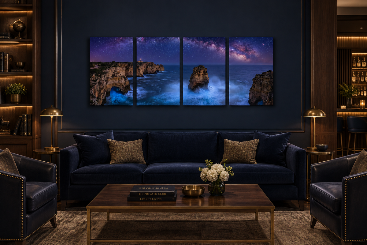 Four-panel Algarve Coast at Night canvas above a navy sofa in a five-star private club lounge with walnut and brass - Portugal Canvas Co