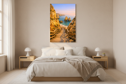Praia do Camilo wooden stairway Algarve coastal canvas wall art displayed above a bed in a bright minimalist bedroom - Portugal Canvas Co