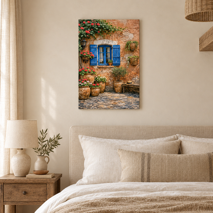 Portrait canvas of a terracotta courtyard with blue shutters and red flowers above a neutral bedroom - Portugal Canvas Co