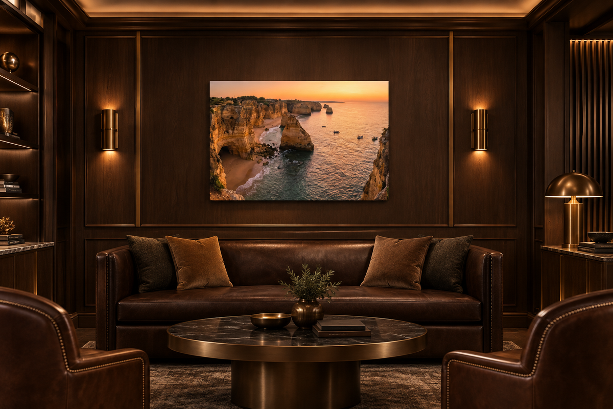 Algarve cliffs sunset canvas above a leather sofa in a dark wood private club lounge - Portugal Canvas Co
