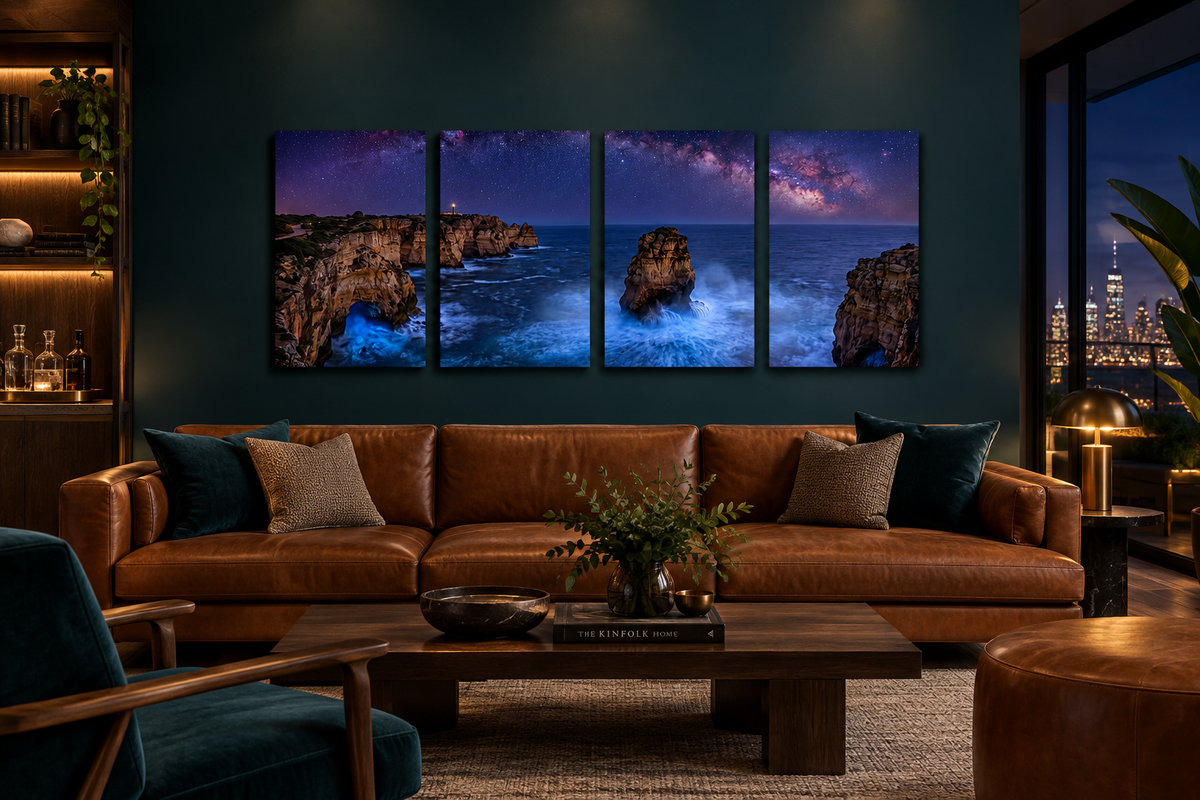 Four-panel Algarve night coast canvas above a cognac leather sofa in a deep teal luxury lounge - Portugal Canvas Co