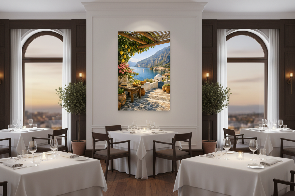 Mediterranean terrace canvas print hung on a white wall in an elegant restaurant dining room with white linen tables and warm evening lighting - Portugal Canvas Co