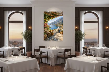 Mediterranean terrace canvas print hung on a white wall in an elegant restaurant dining room with white linen tables and warm evening lighting - Portugal Canvas Co