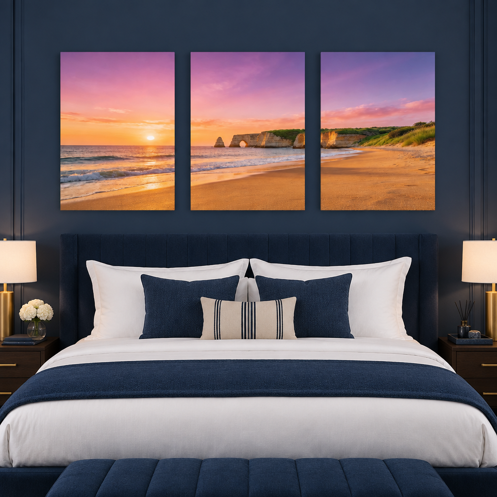 Three-panel Algarve cliff arch and beach sunset canvas set in a navy boutique hotel bedroom - Portugal Canvas Co