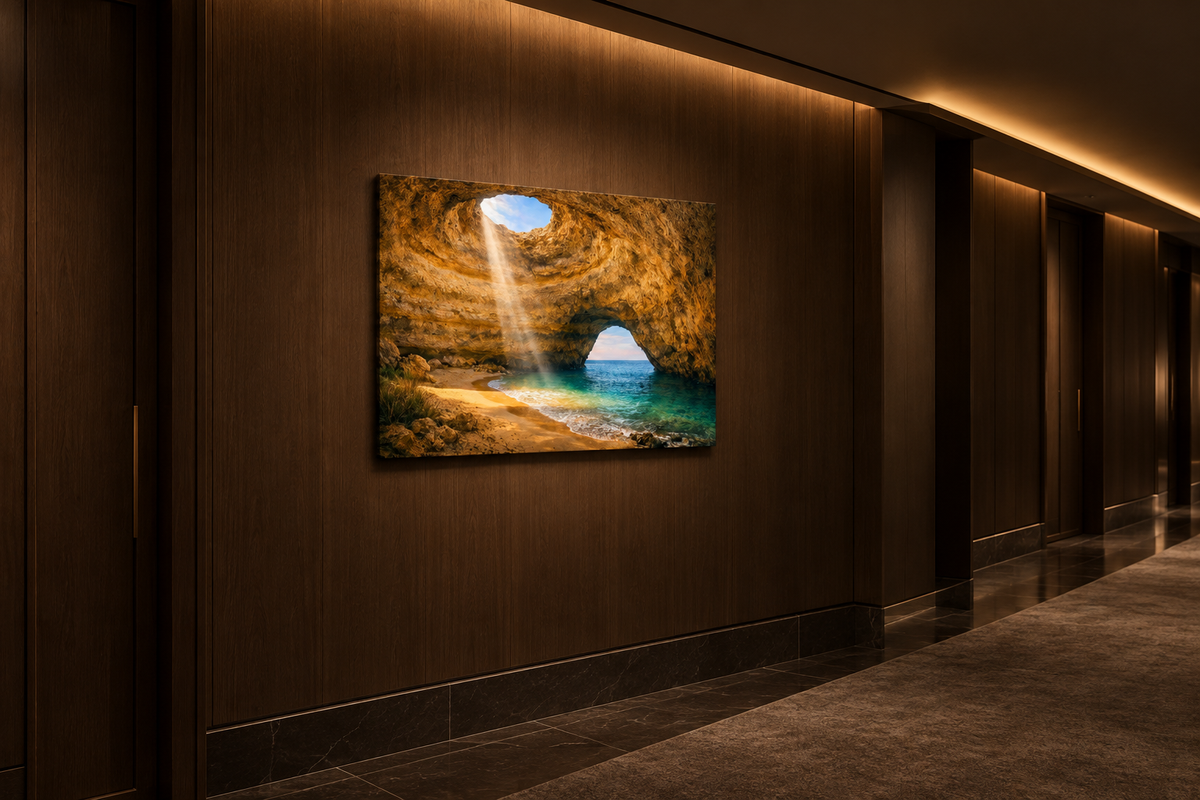 Benagil Cave sunbeam canvas evenly lit on a dark oak wall in a boutique hotel corridor - Portugal Canvas Co