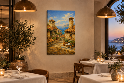 Mediterranean village and sea view canvas displayed in an elegant restaurant dining room at dusk - Portugal Canvas Co