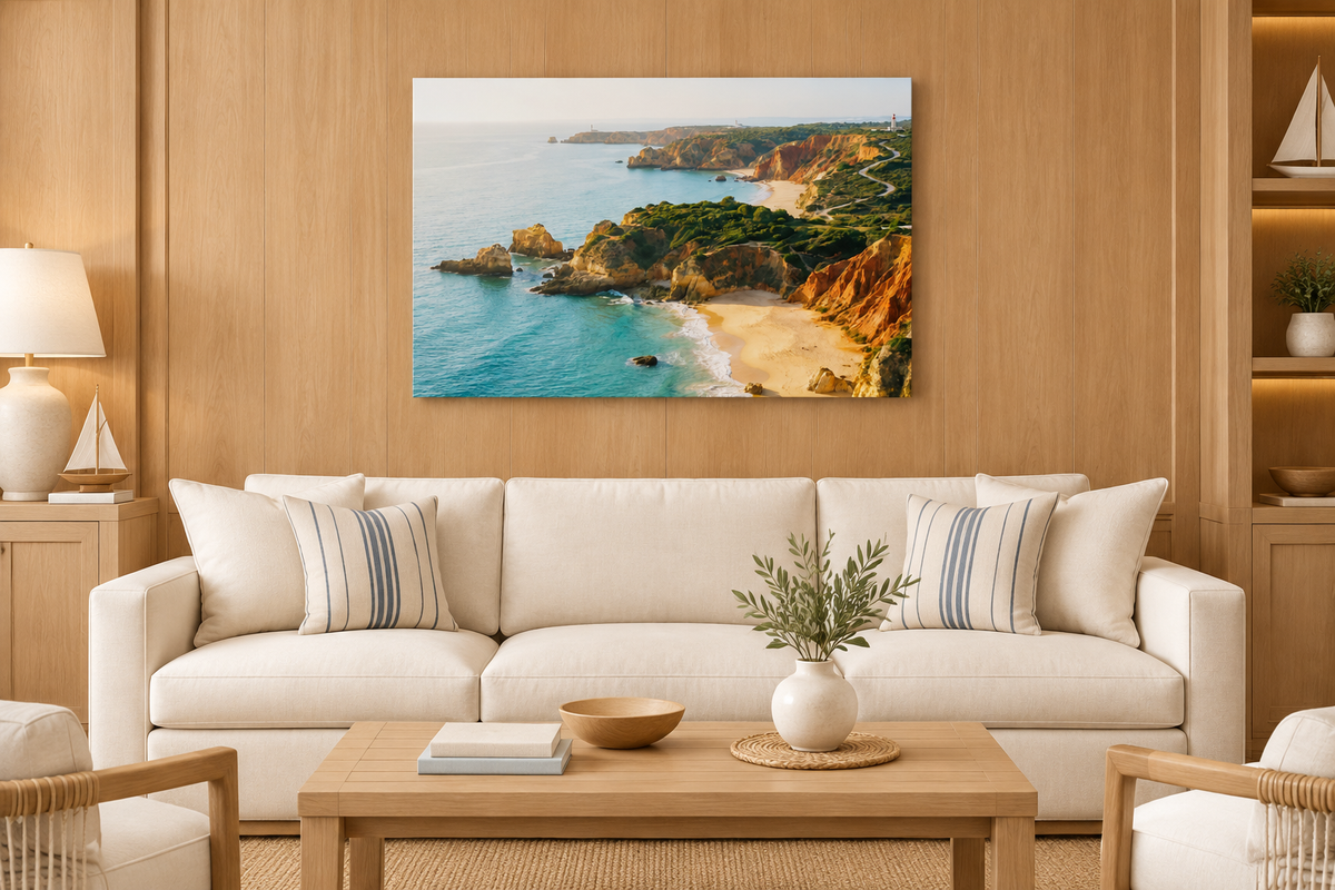 Algarve cliff and beach canvas above cream sofa in teak-lined yacht club lounge - Portugal Canvas Co