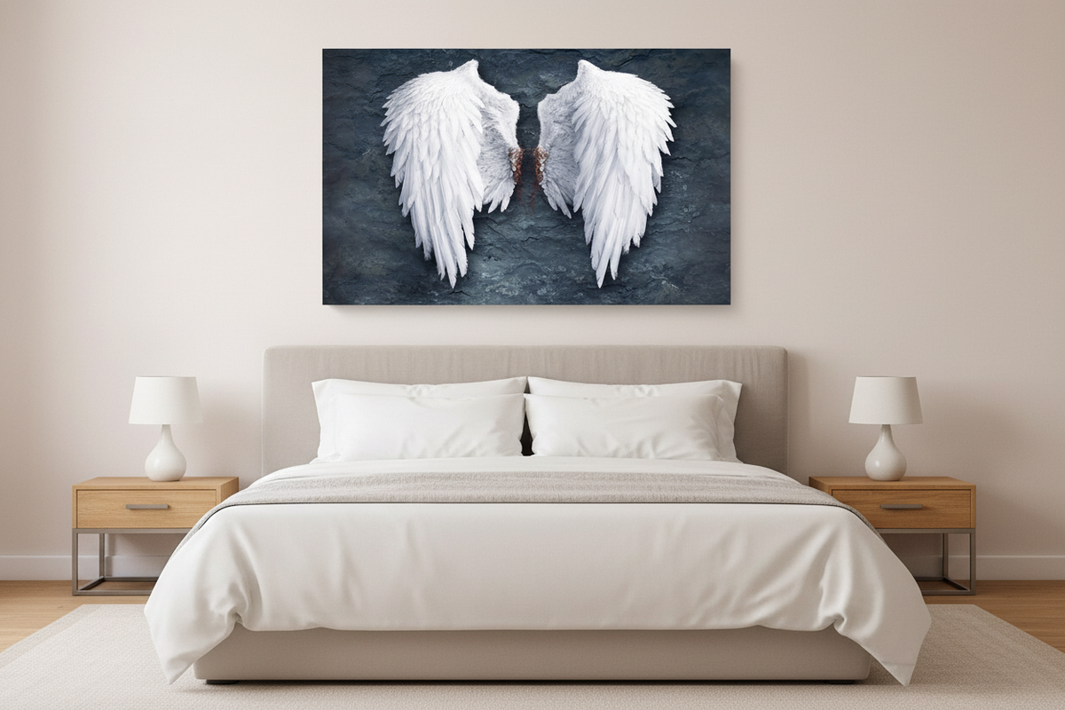 White angel wings on dark textured background canvas wall art displayed above a king bed with white linen bedding in a serene minimalist bedroom - Portugal Canvas Co