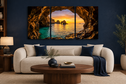 Algarve cave sunset three-panel canvas displayed above a cream sofa in a navy luxury living room - Portugal Canvas Co