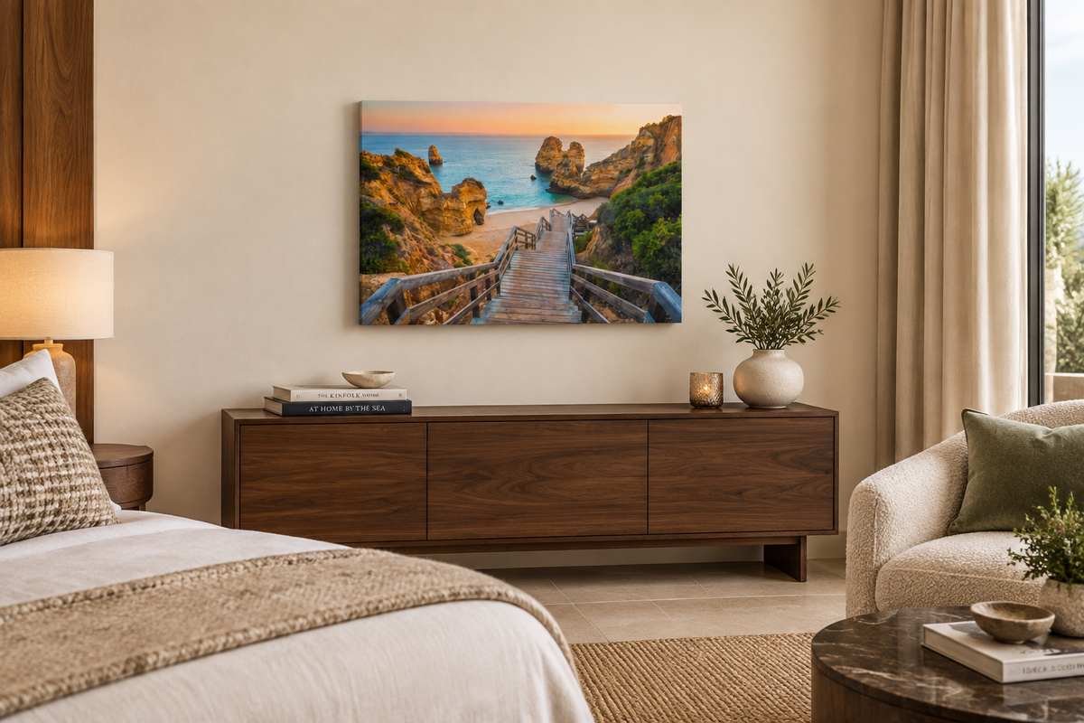 Algarve beach staircase canvas with cliffs and sea at sunset above a walnut console in a boutique hotel suite - Portugal Canvas Co