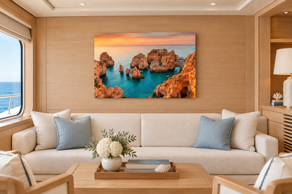 Ponta da Piedade sunset rock arch canvas above cream sofa in teak-lined yacht club lounge - Portugal Canvas Co