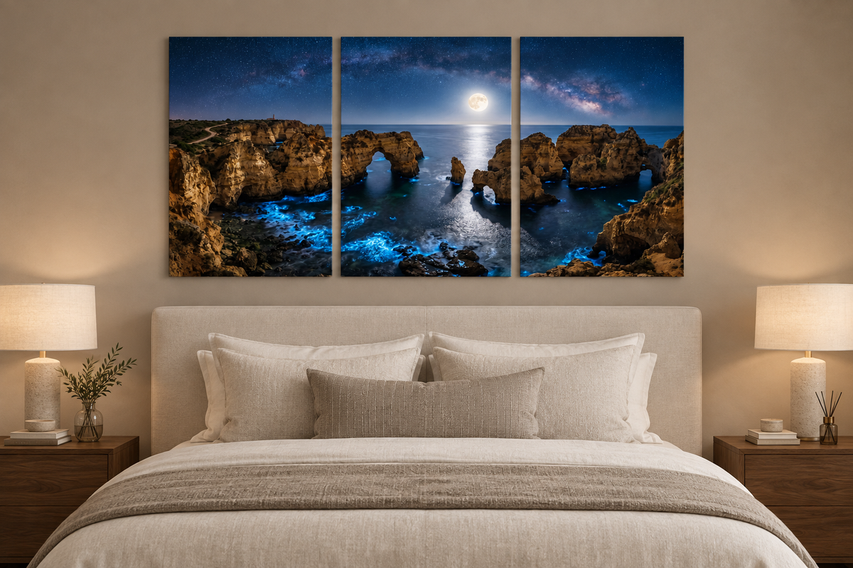 Moonlit Algarve coast three-panel canvas above an ivory bed in a taupe bedroom - Portugal Canvas Co