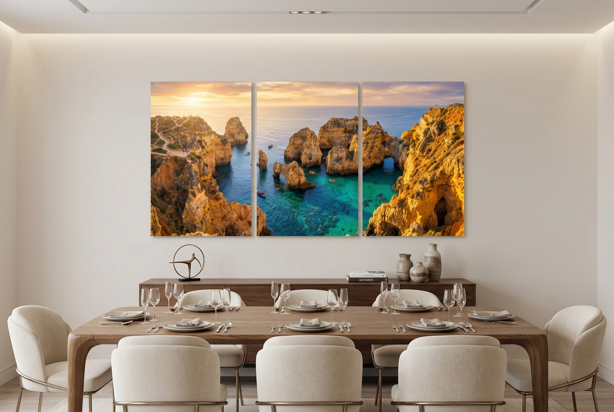 Three-panel coastal sunset canvas showing golden cliffs and turquoise sea in an elegant dining room - Portugal Canvas Co