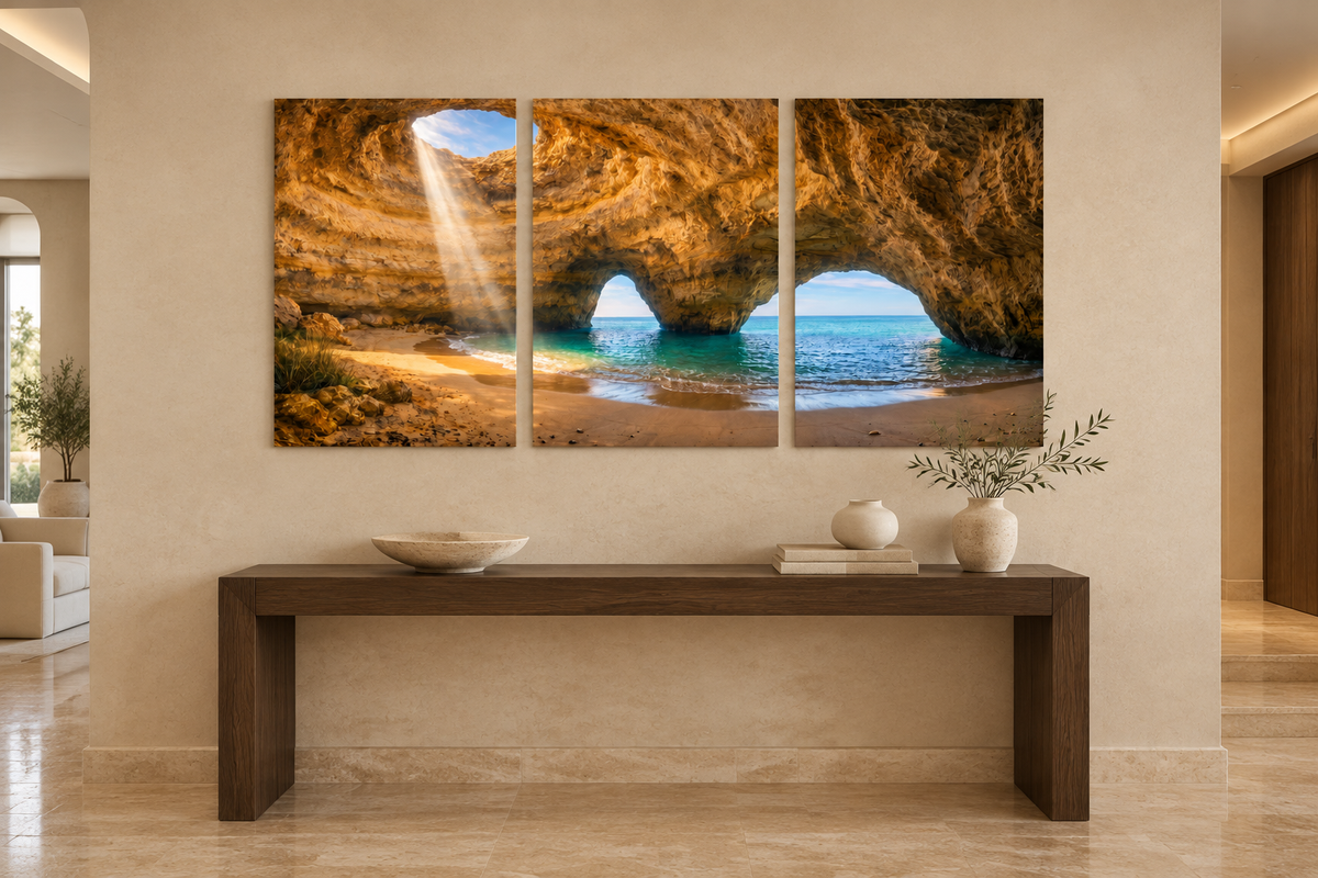 Benagil cave three-panel canvas above an oak console in a limestone entrance hall - Portugal Canvas Co