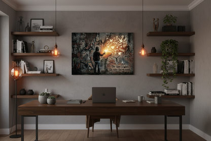 Be The Light In The Darkness graffiti canvas print displayed in a stylish urban home office with dark wood desk and Edison bulb lighting - Portugal Canvas Co