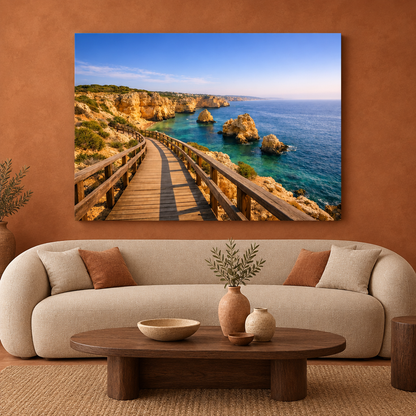 Carvoeiro Boardwalk coastal canvas above a curved cream sofa against a terracotta wall - Portugal Canvas Co
