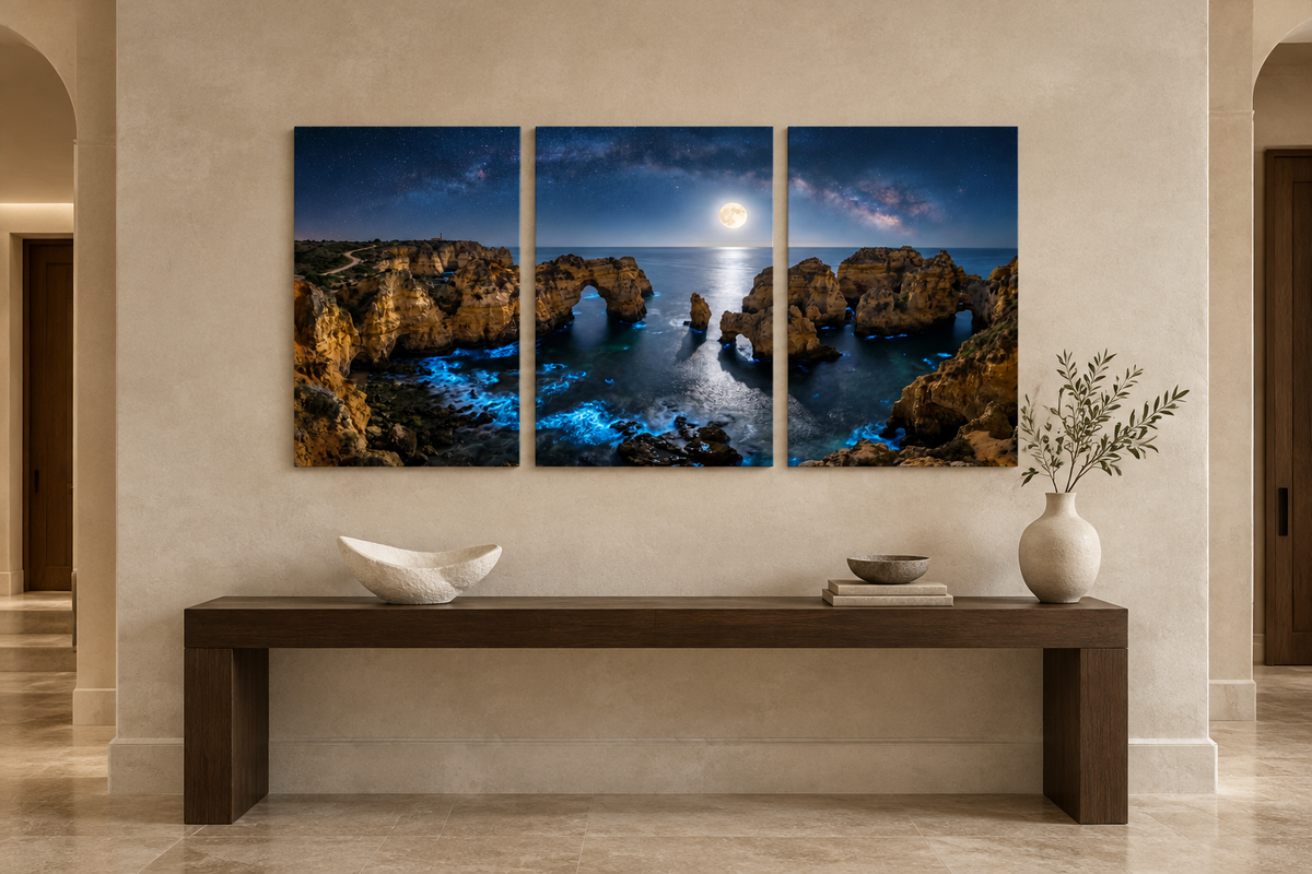 Moonlit Algarve coast three-panel canvas above an oak console in a limestone entrance hall - Portugal Canvas Co