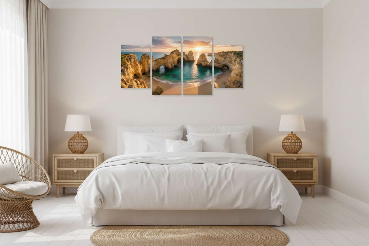 Ponta da Piedade Algarve golden sunset four-panel canvas wall art above king bed in coastal master bedroom with white linen and rattan furniture - Portugal Canvas Co
