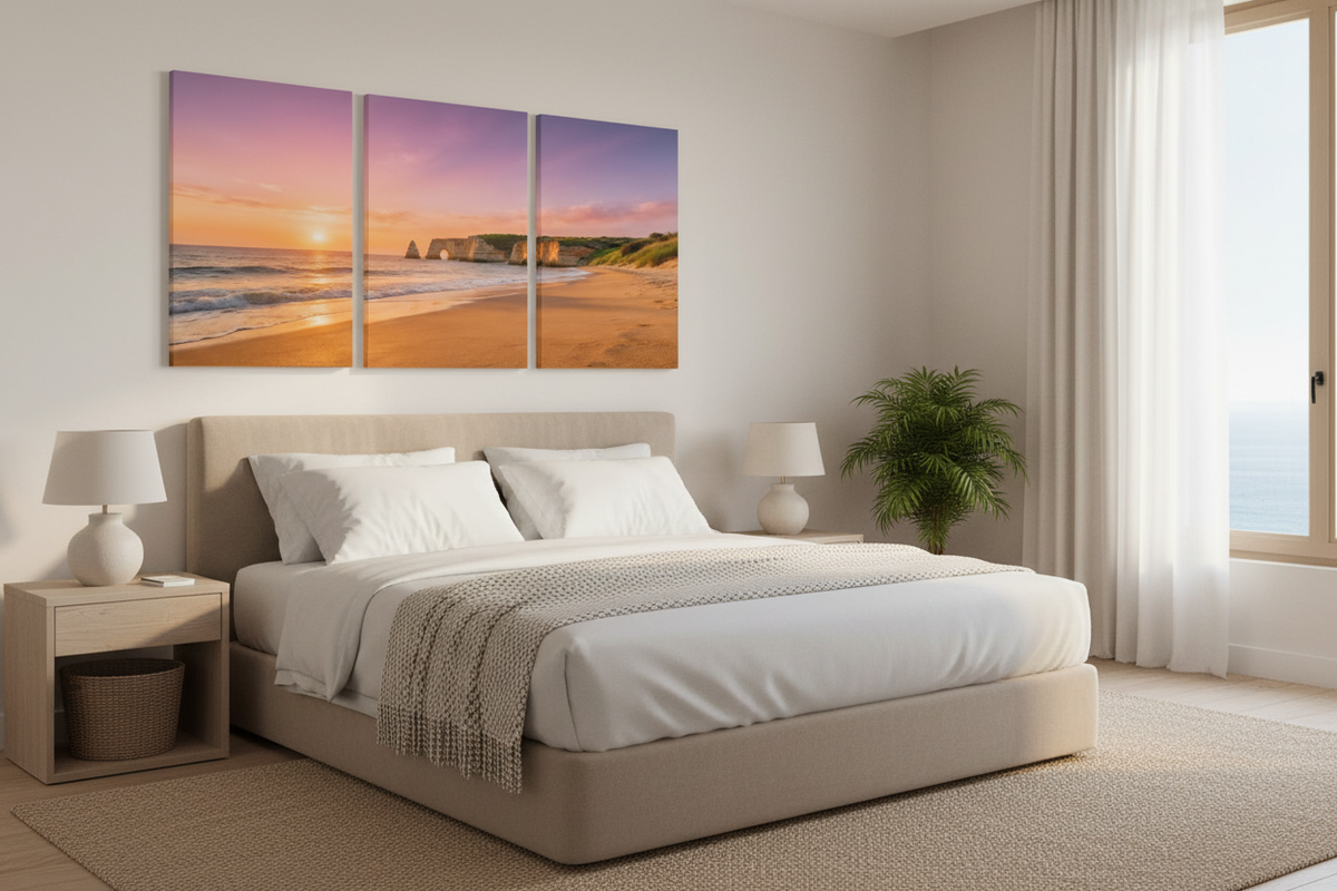 Three-panel beach canvas triptych above a boutique hotel bed - Portugal Canvas Co