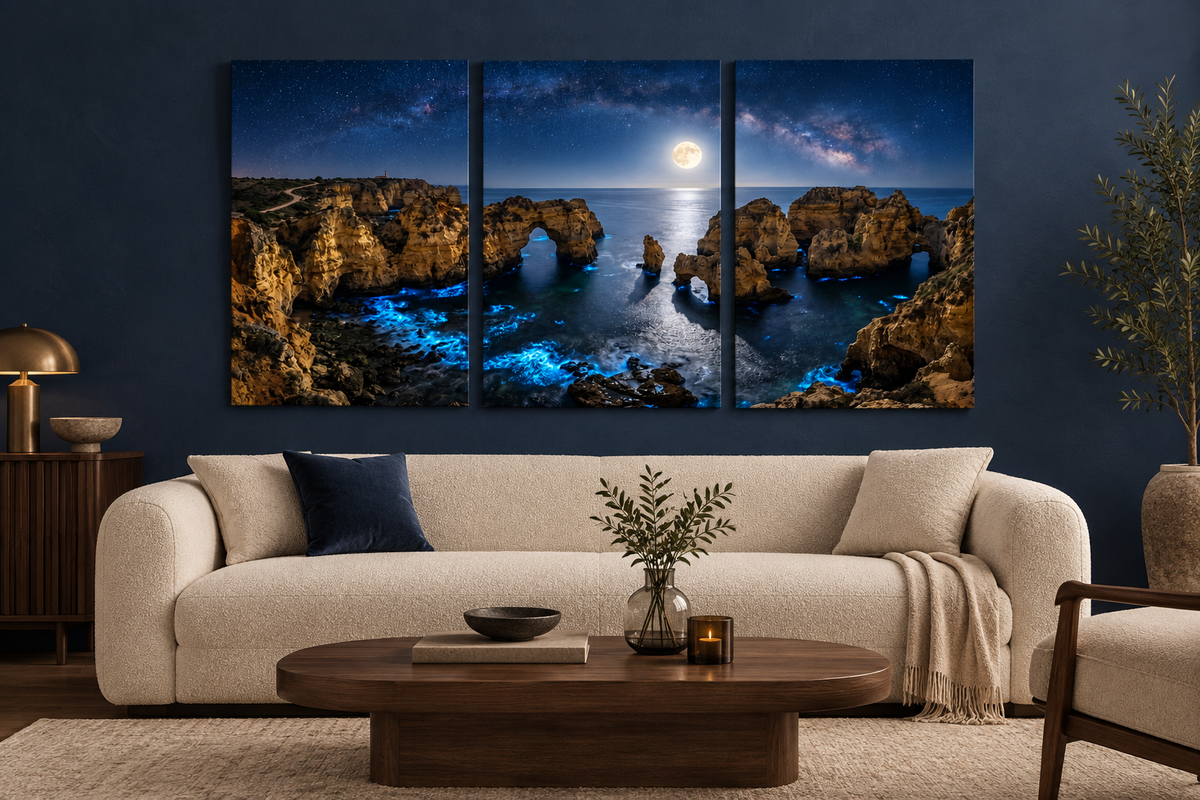 Moonlit Algarve coast three-panel canvas above a cream sofa in a navy living room - Portugal Canvas Co